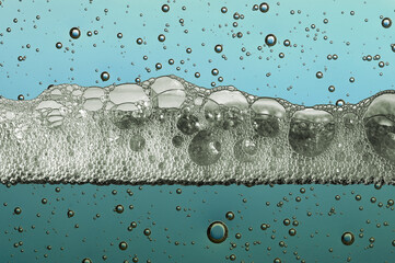 water surface section with air bubbles and foam, pollution concept