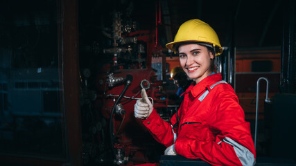 Portrait of Industrial engineers inspect and perform maintenance on the machines at factory...