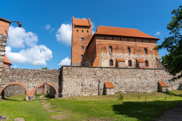 Interior of Trakai Castle. Full of towers and built by a red brick. Photo made on a sunny summer morning.