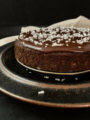 Spelt Coconut Chocolate Cake with Coconut Milk Ganache (close up side view)