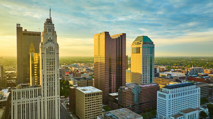 Four main downtown Columbus Ohio skyscrapers aerial at sunrise with golden lighting