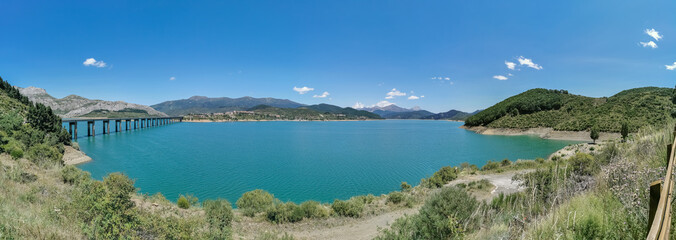 Naklejka premium Panoramic view at the Riaño Reservoir, located on Picos de Europa or Peaks of Europe, a mountain range forming part of the Cantabrian Mountains in northern Spain...