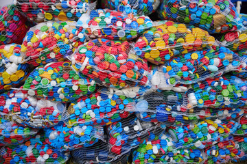 Fototapeta na wymiar Lots of plastic bottle caps