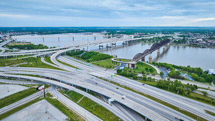Four bridges over Ohio River Aerial view white gold, concrete, and iron arch truss with highways