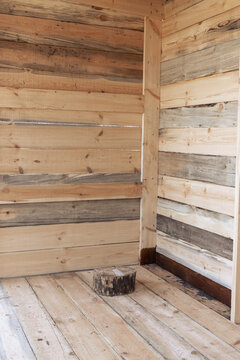 Wooden room. Room corner with wooden walls and floor