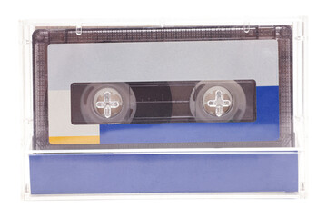 Close up of retro audio cassette tape, in case, isolated on white background, vintage 80's music concept.