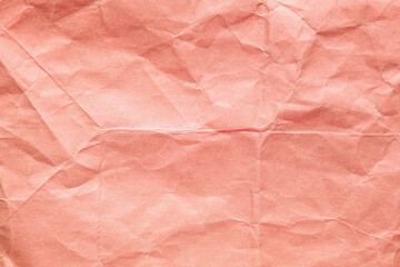 Fototapeta premium Orange crumpled kraft background paper texture