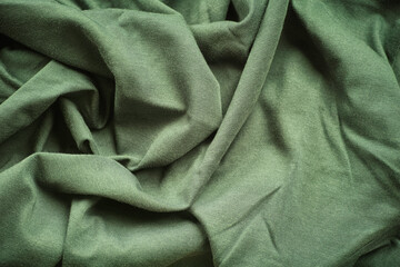 A crumpled green fabric background