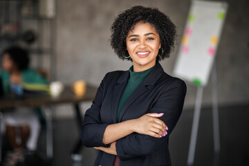 Portrait Of Happy Black Businesswoman Smiling Standing At Modern Office