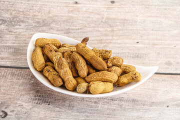 Raw ripe unpeeled peanut heap
