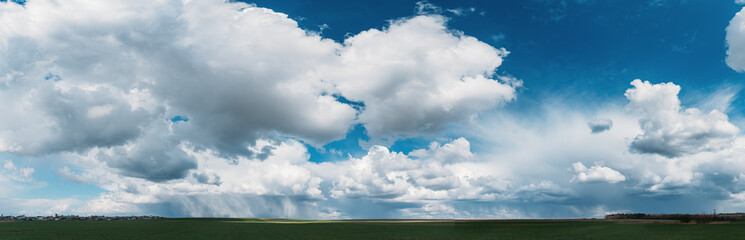 Sky During Rain Horizon Above Rural Landscape Field. Agricultural And Weather Forecast Concept. Storm, Thunder, thunderstorm, stormclouds, Rainy Day, stormclouds Sky During Rain Horizon. panorama
