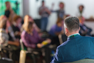 Presence of an expert as he delivers a compelling speech at a panel discussion, captivating the...