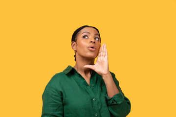 Funny Black Lady Shouting Holding Hand Near Mouth, Yellow Background