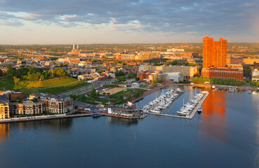 Bird's eye view of the Baltimore’s Inner Harbor and Federal Hill Park at sunrise, Maryland.  Baltimore is a major city in Maryland with a long history as an important seaport.