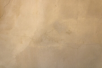 Texture of old dirty beige stucco wall