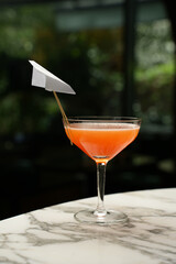 Fresh cocktail glass on a marble bar table