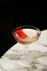 Red line cocktail glass on a marble bar counter