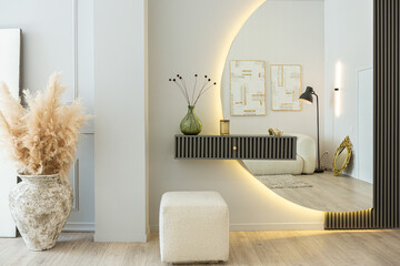 bright open-plan apartment in a modern design, light walls and wooden floor. stylish hallway with a...