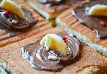 Cakes with chocolate and bananas