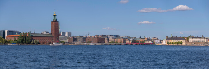Panorama, the Town City Hall, the down town and old town at the bay Riddarfjärden, a sunny summer day in Stockholm