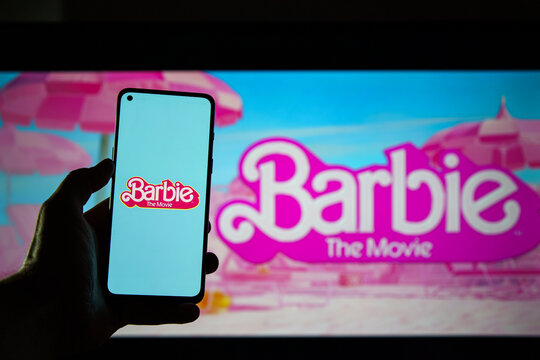 The barbie movie logo and poster on screen