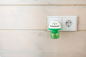 Close-up of fumigator works at home. Useful device against insects