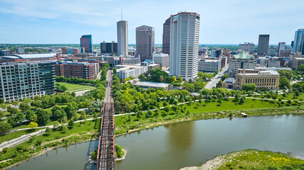 Train bridge leading into downtown of Columbus Ohio past American Electric Power skyscraper aerial