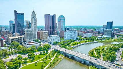 Green parks and bridge with downtown view of Columbus Ohio aerial