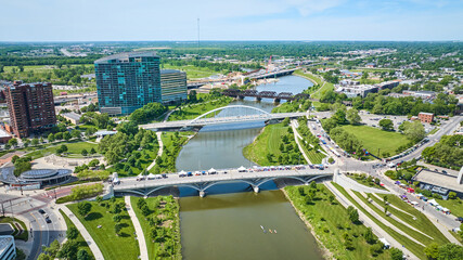 Scioto River aerial with multiple bridges and kayaks on water near city