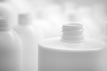 Close up of a white plastic bottle on white background