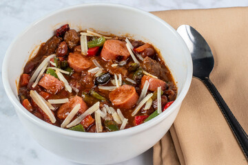 chili  with hot dogs  peppers and cheese