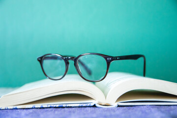 eye glasses set on open book