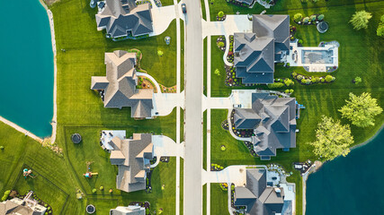 Aerial landscaping rich mansion neighborhood homes roof view aerial