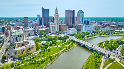 Fototapeta na wymiar Drone view downtown Columbus Ohio over Scioto River with bridge and distant skyscrapers