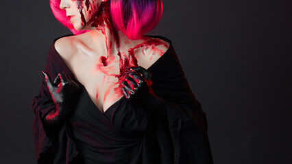 fighting geisha in a black kimono splashes blood on her face. Halloween image. young multiethnic...