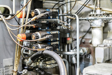 Hydraulic control system for CNC machine mechanics.