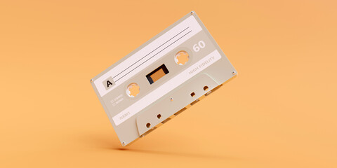 Fototapeta premium Retro audio cassette tape with blank label on pastel orange background