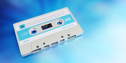 Retro audio cassette tape with blank label on blue background