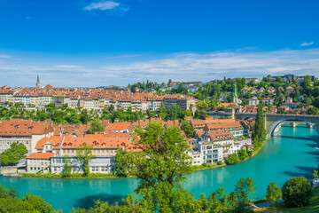 Fototapeta na wymiar Panoramic view of Aare river, Nydeggbrucke bridge and old town of Bern, Switzerland 