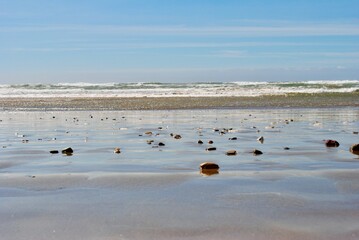 The waves roll in and out on a beach in Pismo, California.