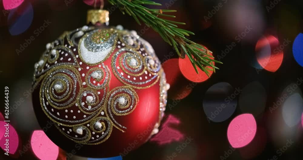 Aufkleber christmas tree decorated red ball toy, fir branch with balls and festive lights on the christmas bac