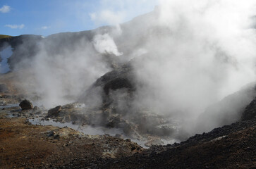 Fototapeta na wymiar Hot Steam Rising from Fumaroles in Rugged Iceland