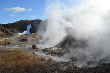 Geothermal Steam Rising from Active Volcanic Landscape