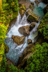 Amazing Soca river rocky, canyon landscape in Triglav mountain national park, deep in slovenian Alps hidden in dense vegetation