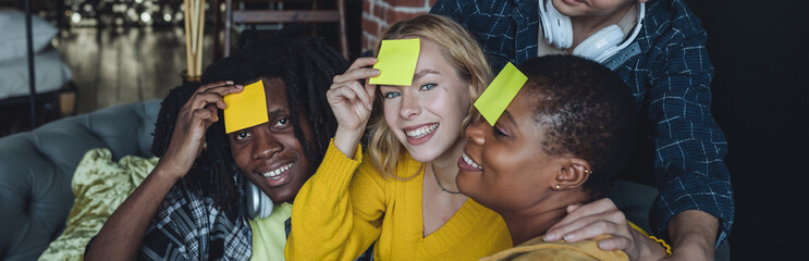 Diverse group of young people, friends, college students gathering together, have fun, playing games, laughing. Concept of diversity, international friendship, foreign languages, university. Banner