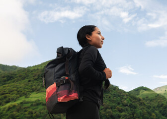 young woman hiking in the mountains of colombia
