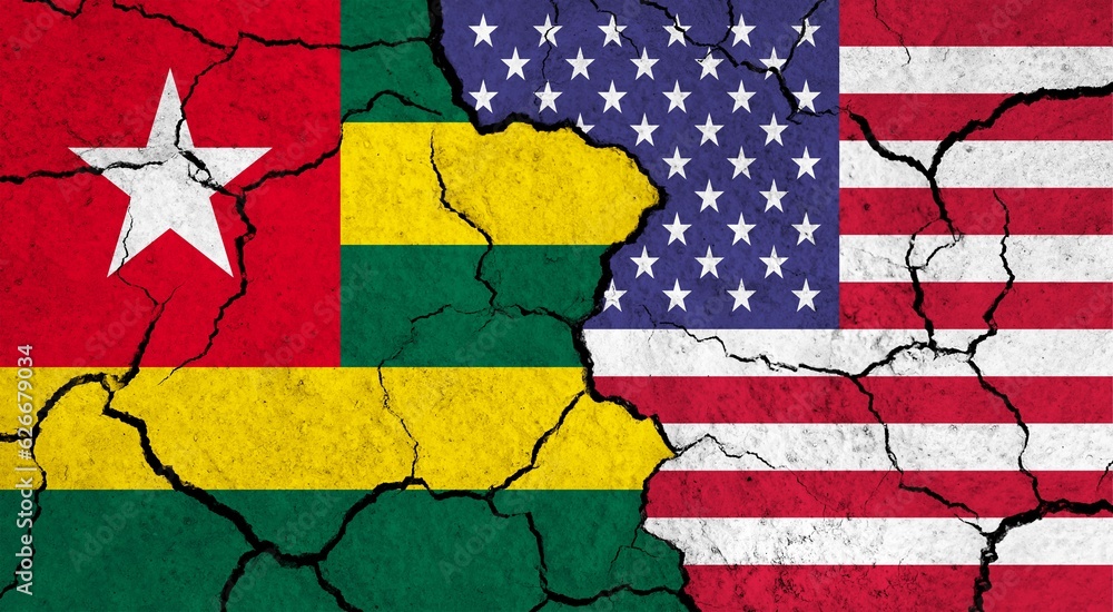 Wall mural flags of togo and usa on cracked surface - politics, relationship concept