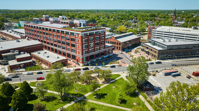 Aerial of park playground near old General Electric Works factory building in downtown Fort Wayne