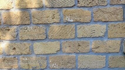 the background texture is Sandstone. Sandstone wall. brick Sandstone. shell rock brick wall