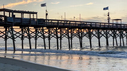 Pier with ocean waves in Myrtle Beach